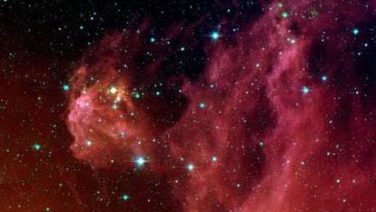 Nascent stars inside reddish clouds in the Orion Belt, 1,300 light years away from Earth.