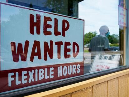 File - A help wanted sign is displayed in Deerfield, Illinois, in 2022.