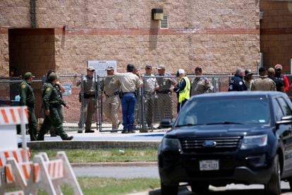 Police and other first responders gather outside Robb Elementary School after a shooting May 24, 2022, in Uvalde, Texas.