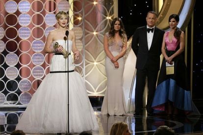 Jennifer Lawrence receives the Best Supporting Actress award for her role in ‘American Hustle.’
