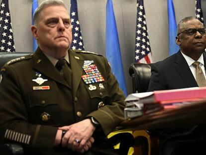 Defense Secretary Lloyd Austin, right, and Chairman of the Joint Chiefs of Staff GenerAL Mark Milley, attend a virtual meeting of the Ukraine Defense Contact Group on March 15, 2023, at the Pentagon.