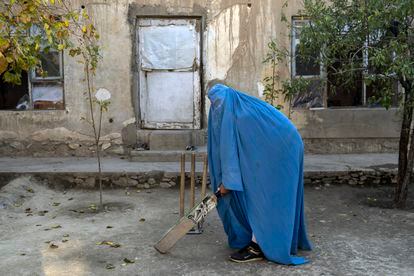 Afghan women played a wide variety of sports, including cricket. A number of women posed for an AP photographer for portraits with the equipment of the sports they loved. Though they do not necessarily wear the burqa in regular life, they chose to hide their identities with their burqas because they fear Taliban reprisals and because some of them continue to practice their sports in secret. 