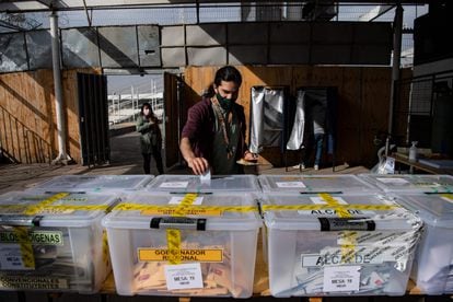 A man casts his vote during local elections in Chile, March 2021.
