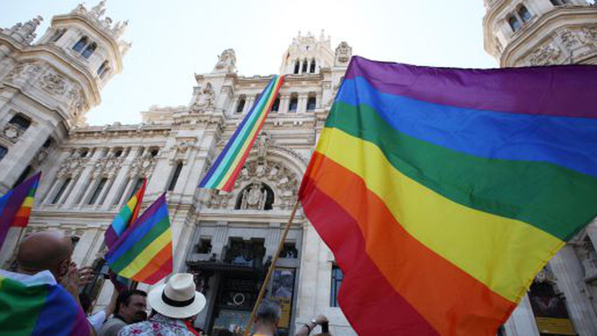 Rainbow flags fly from official buildings in Madrid and Valencia, Spain