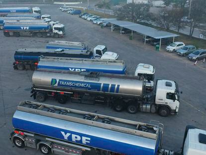 Aerial view of parked trucks waiting to load fuel to distribute it in the national territory at YPF refinery on August 1, 2022 in La Plata, Argentina.