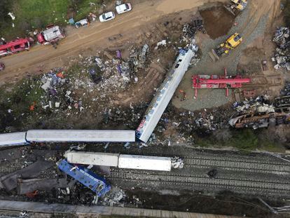 The wreckage of the trains lie on the rail lines, after Tuesday's rail crash the country's deadliest on record.