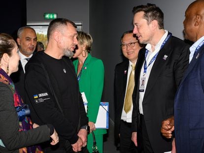 Ukraine's Deputy Minister for Digital Transformation Georgii Dubynskyi speaks with Elon Musk on day one of the AI Safety Summit at Bletchley Park in Bletchley, Britain on November 1, 2023.