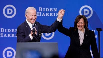 Joe Biden and Kamala Harris hold hands onstage after speaking at the Democratic National Committee winter meeting on February 03, 2023 in Philadelphia, Pennsylvania. 