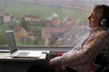 A passenger relaxes on Spain’s high-speed AVE service.