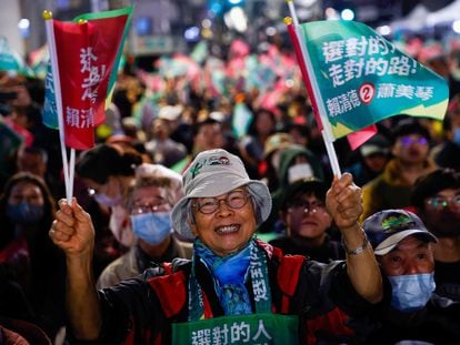 Supporters of the winning Democratic Progressive Party wait for preliminary results near the party's headquarters in Taipei on January 13.