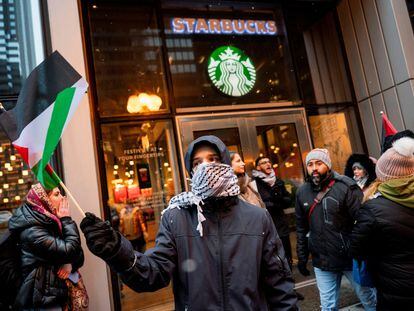Activists of the group 'Chicago Youth Liberation for Palestine' protest in support of Palestinians at a Starbucks, in Chicago, Illinois, December 31, 2023.