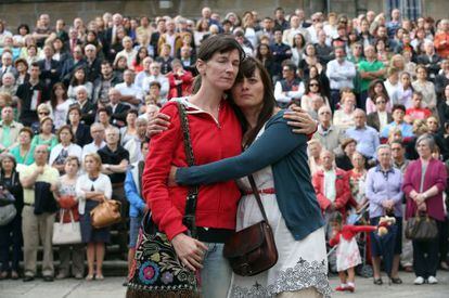 Two women embrace during the funeral mass for the 79 victims in Santiago de Compostela on Monday.