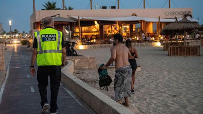 A police officer patrolling a beach in Palma, on the island of Mallorca.