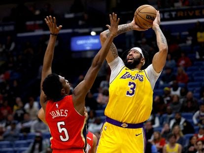 Anthony Davis #3 of the Los Angeles Lakers shoots over Herbert Jones #5 of the New Orleans Pelicans during the third quarter at Smoothie King Center on March 14, 2023 in New Orleans, Louisiana.