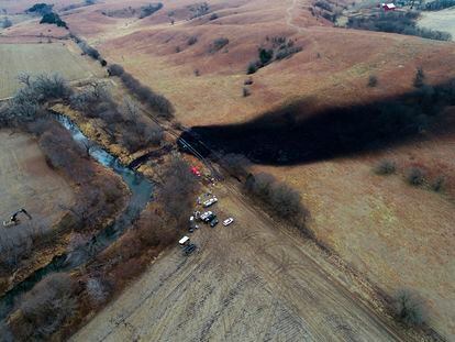 In this photo taken by a drone, cleanup continues in the area where the ruptured Keystone pipeline dumped oil into a creek in Washington County, Kan., on Dec. 9, 2022.