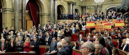 Spanish and Catalan flags on display inside the Catalan parliament after the historic vote on the separatist motion.