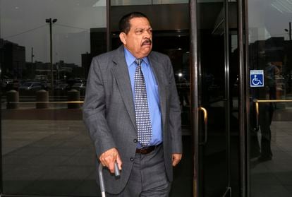 In this Aug. 22, 2013 file photo, former El Salvadoran military colonel Inocente Orlando Montano walks out of federal court in Boston.