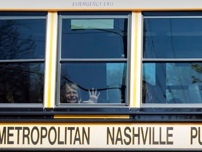 A child weeps while on the bus leaving The Covenant School following a mass shooting at the school in Nashville, Tennessee, on March 27, 2023.