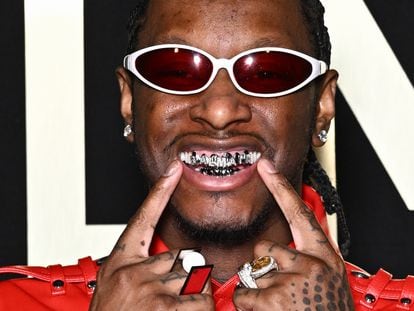 Stylist and influencer Bloody Osiris, seen wearing his grill, attends a runway show during Paris Fashion Week, on January 20.