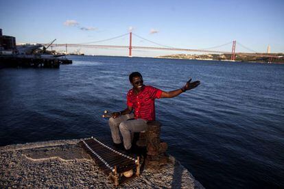 Guinea-Bissau-born Kimi Djabate with his balafon on the banks of the River Tajo. Lisbon's music scene is vibrant and varied.