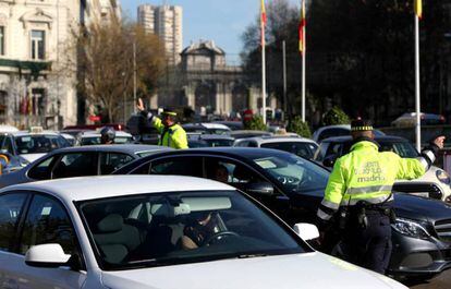 Traffic police direct vehicles in central Madrid.