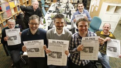 The team behind the EL PAÍS ENGLISH EDITION, pictured with the proofs of the last print issue.