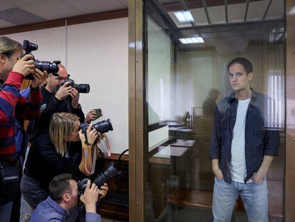 'Wall Street Journal' reporter Evan Gershkovich stands inside an enclosure for defendants before a court hearing to consider an appeal against his pre-trial detention on espionage charges in Moscow, Russia, October 10, 2023.