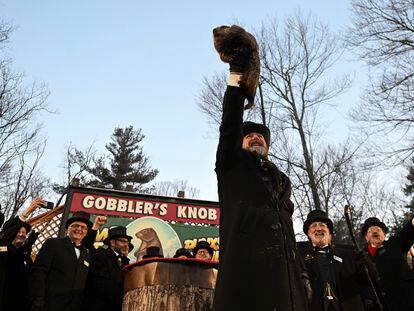 Groundhog Club handler A.J. Dereume holds Punxsutawney Phil, the weather prognosticating groundhog, during the 137th celebration of Groundhog Day on Gobbler's Knob in Punxsutawney, Pa., Thursday, Feb. 2, 2023.