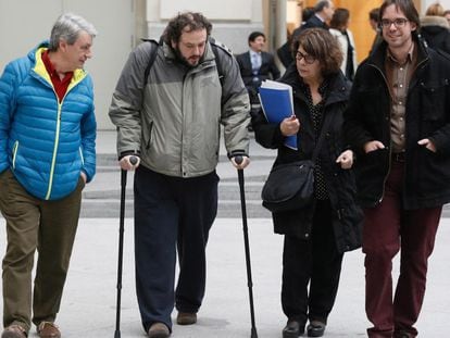 Guillermo Zapata (on crutches) with other Ahora Madrid coalition members outside City Hall on Thursday.