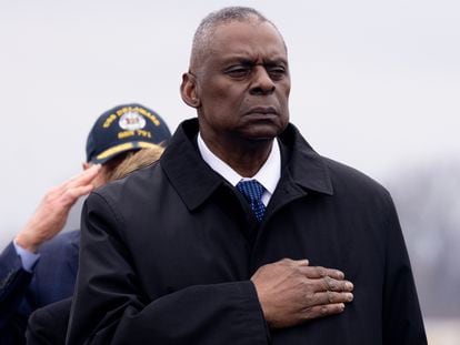 US Secretary of Defense Lloyd Austin watches a US Army carry team move a flag-draped transfer case containing the remains of a fallen US service member during a dignified transfer at Dover Air Force Base in Dover, Delaware, February 02, 2024.