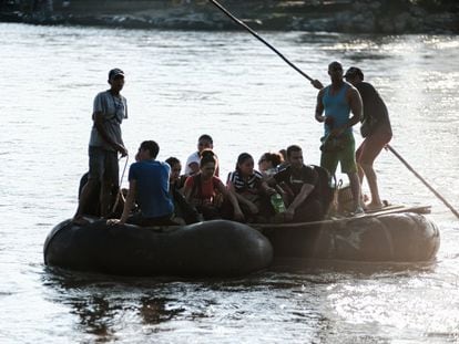 A group of Cuban migrants crossing the Suchiate River, the natural border between Guatemala and Mexico.
