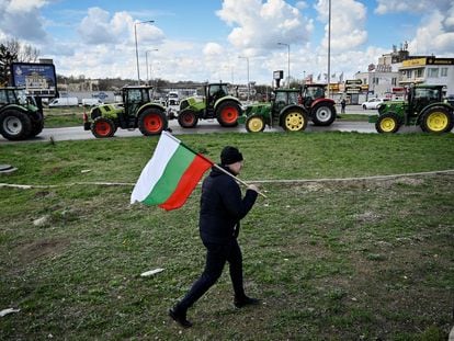 A farmer with a Bulgarian flag, during a protest to block the passage of trucks with Ukrainian grain from Romania, on March 29.