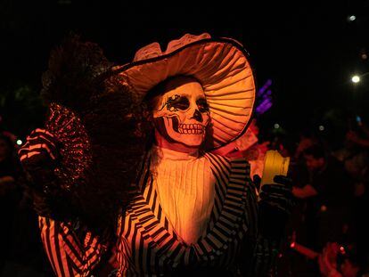 A woman dressed as Catrina in a Mexico City parade; October 22, 2023.
