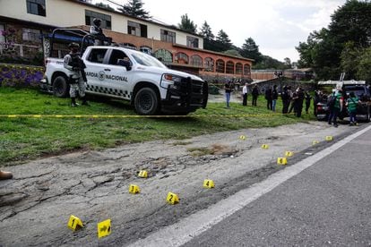 The National Guard officers guard the site of a shootout between police and suspected members of the Sinaloa cartel on July 12, 2022, in Mexico City.
