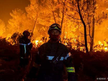 Firefighters at the front of a fire near Belin Beliet, south of Bordeaux, France, on August 10.