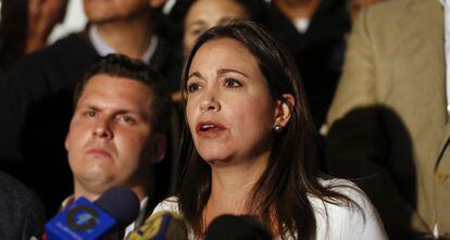 Opposition Deputy María Corina Machado speaks to reporters.