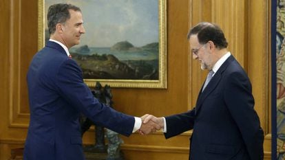 King Felipe greets Mariano Rajoy in July.
