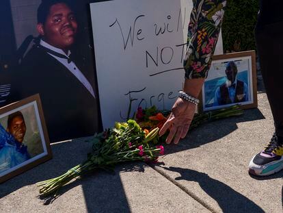 Flowers near a photo of Herman Whitfield III, just outside Indianapolis Metropolitan Police Department's north district station in Indianapolis, on April 11, 2023.