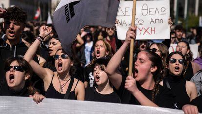 University students chant slogans during a protest as they head to the headquarters of private operator Hellenic Train, in Athens on Friday. 