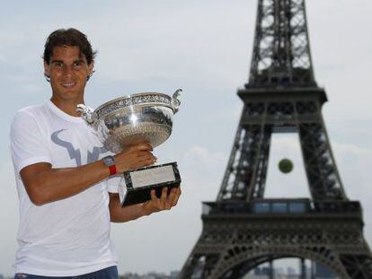 Nadal poses with the Roland Garros trophy in Paris.