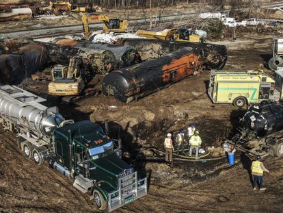 An aerial photo made with a drone shows workers removing contaminants as cleanup continues in the aftermath of a Norfolk Southern freight train derailment that has created concern by residents over the release of toxic chemicals in East Palestine, Ohio, USA, 18 February 2023.