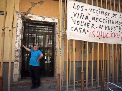 A resident calling on a neighbor in a building condemned after the tremors of 2011.