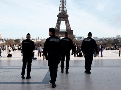 French police and French gendarmes patrol at the Trocadero square near the Eiffel Tower in Paris, France, March 4, 2024.