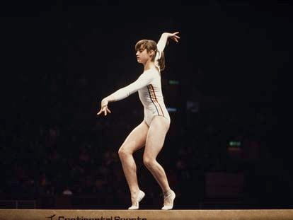 Gymnast Nadia Comaneci performs her exercise on the balance beam at the Montreal Olympic Games on July 19, 1976, in which she achieved seven scores of 10 and three gold medals.