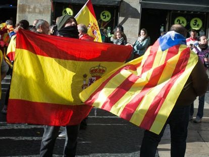 Spanish and Catalan independence flags at a protest in Barcelona.
