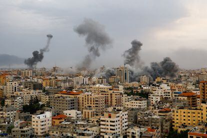 Smoke rises following Israeli strikes in Gaza, on Monday.