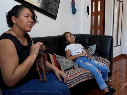 Valerie Torres listens as her mother Francys Brito speaks during an interview in their home in Caracas, Venezuela, on Sunday, February 26, 2023.