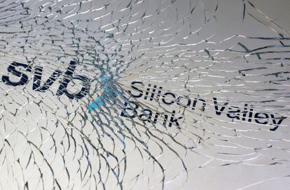 The Silicon Valley Bank logo seen through broken glass.