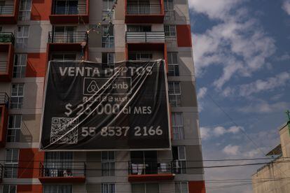 A sign advertising property sales for Airbnb rentals in Mexico City. 