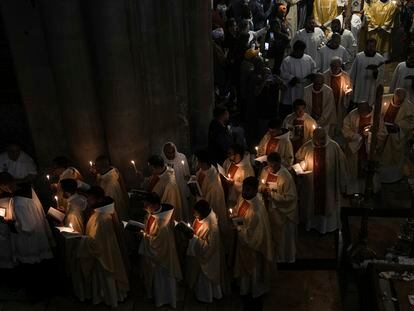 Priests participate in the Easter Sunday Mass led by the Latin Patriarch of Jerusalem Pierbattista Pizzaballa